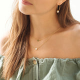 Collier Lucia double chaine triangle et pierre laiton couleur or